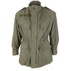 Front view of the original Belgian Army M88 olive green field jacket with four utility pockets, button-fastened wind flap, and internal waist drawstring.
