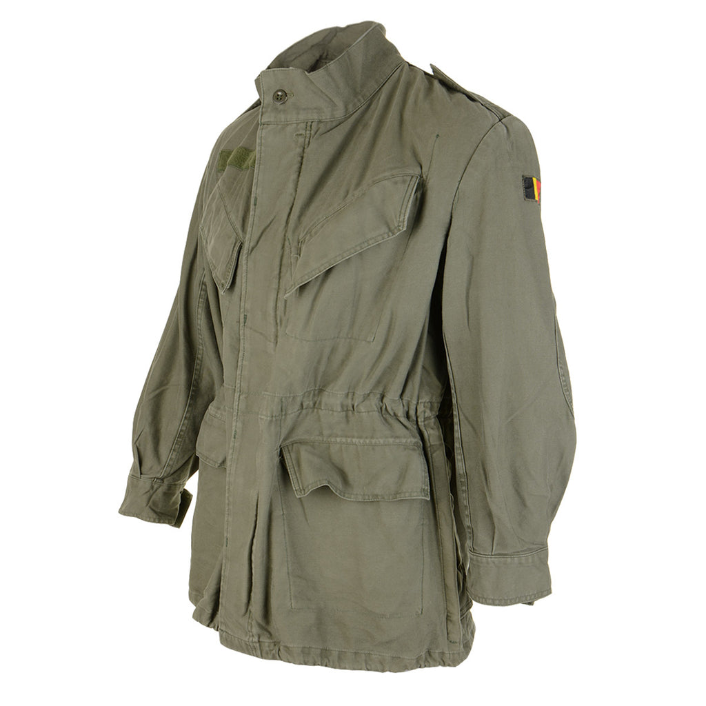 Three-quarter front view of the olive green M88 Belgian military field jacket featuring a distinct Belgian flag patch on the upper left arm.