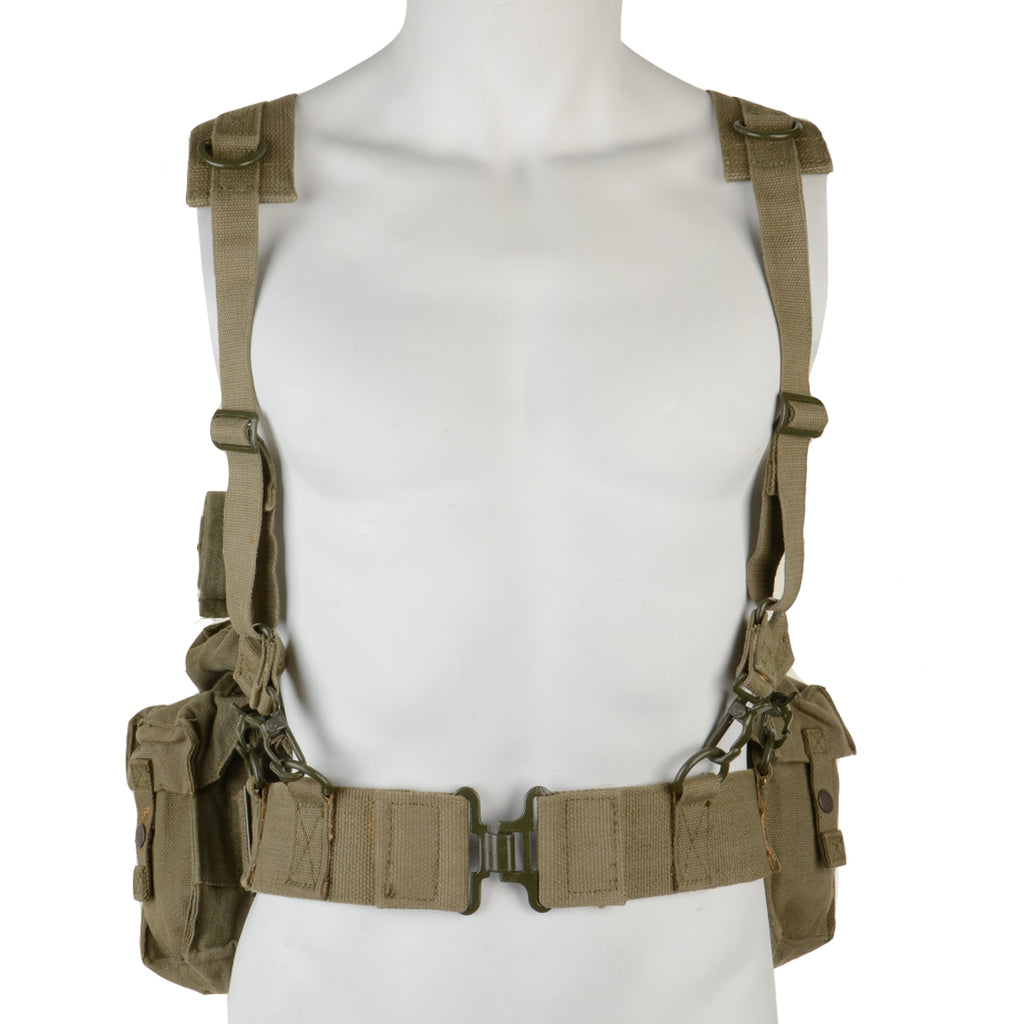 Front view of the SADF 70 Pattern military webbing on a mannequin, highlighting the adjustable canvas belt, metal buckle, and shoulder suspender setup.