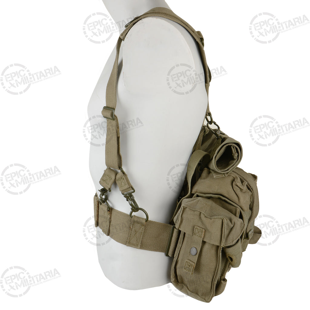 Side profile of the vintage SADF 70 Pattern webbing system, showcasing the durable heavy-duty canvas construction and side-mounted utility kidney pouches.