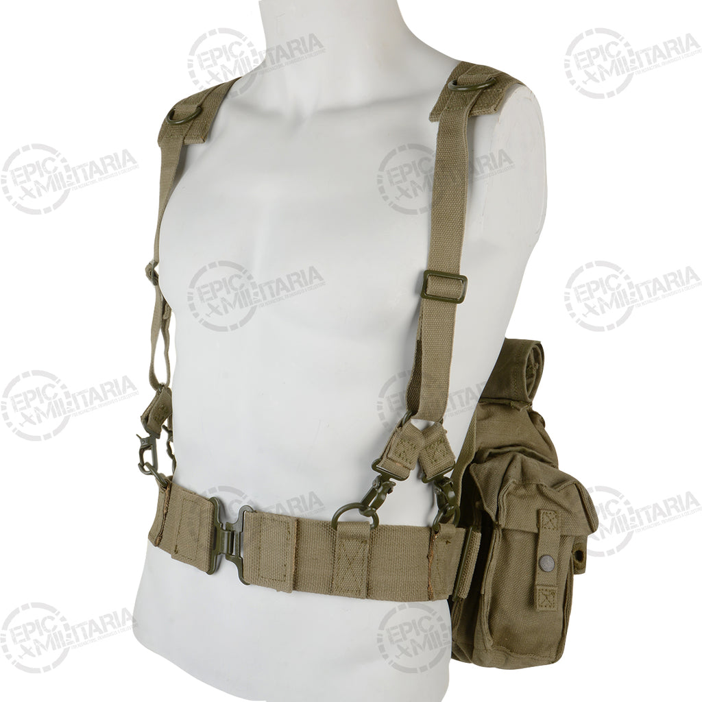 Three-quarter front view of the original SADF 70 Pattern webbing, displaying the Y-strap harness attachment points and metallic hardware on the heavy canvas belt.