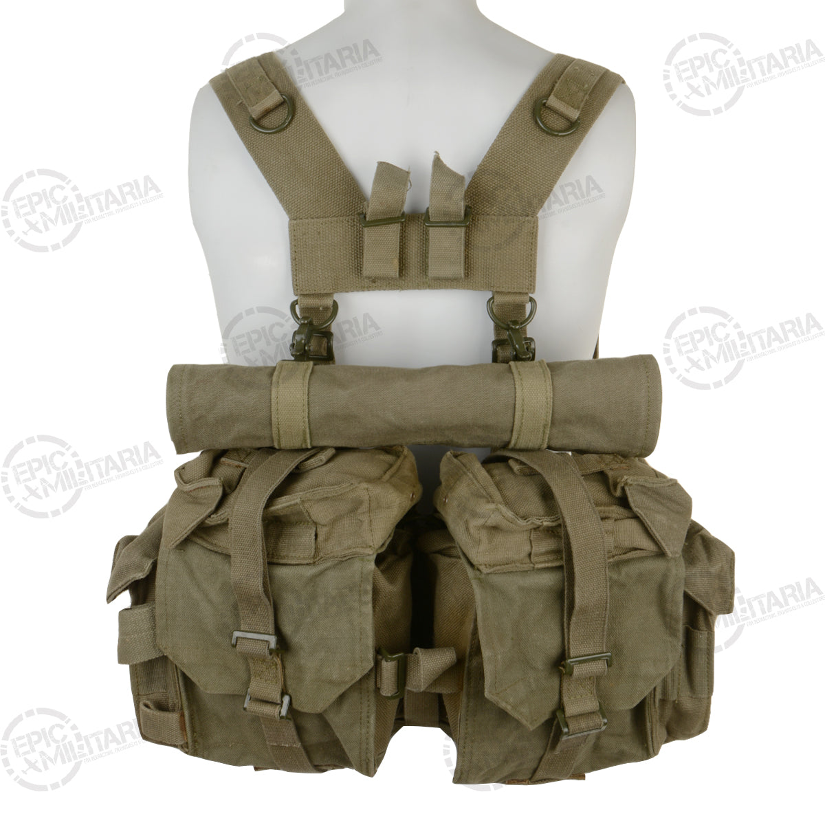 Rear close-up of the SADF 70 Pattern load carriage system, showing the rugged stitching, reinforced D-rings, and the attached poncho roll gear strap.