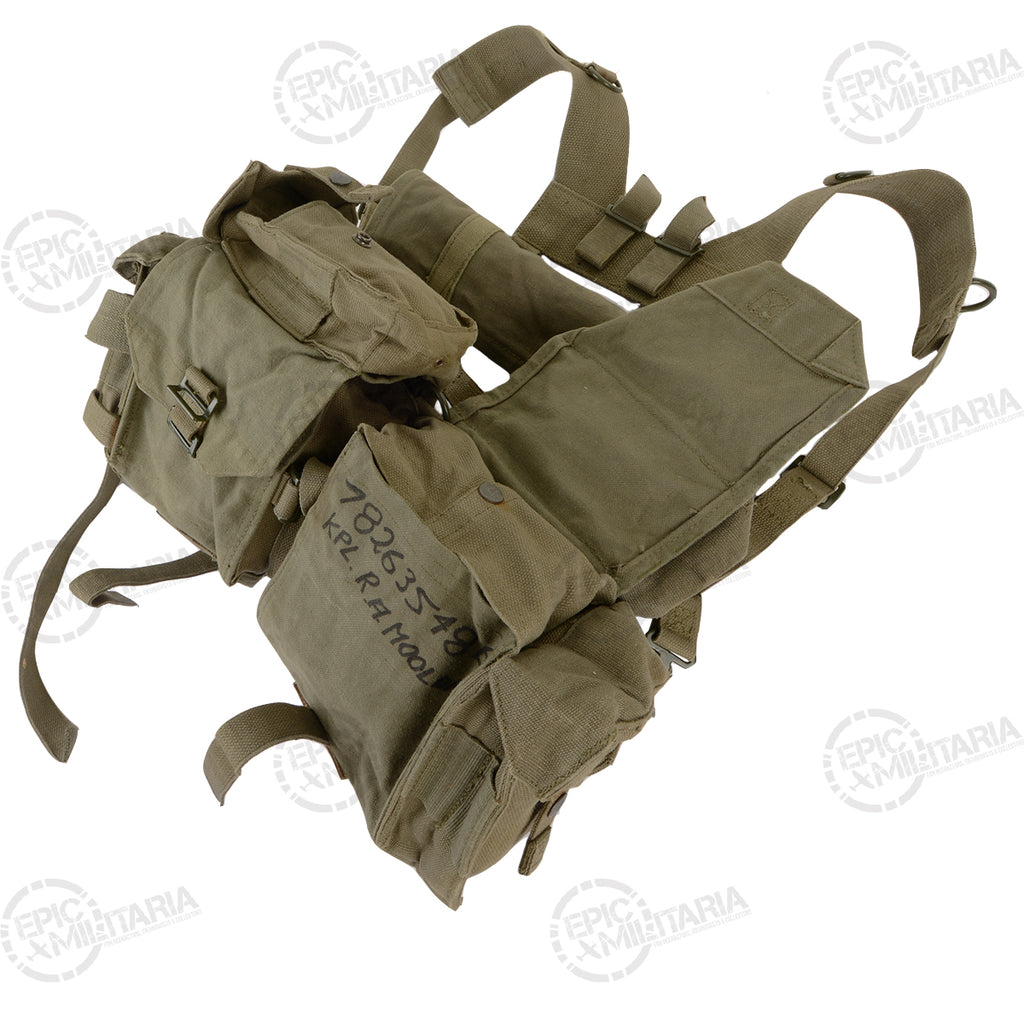 Close-up detail of SADF 70 Pattern webbing pouch featuring authentic hand-inked service numbers and soldier identification for historical character.
