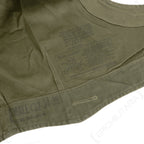 Close-up of the interior of an original M43 hood, displaying stamped military markings including size Small 32-34-36 and stock number details.
