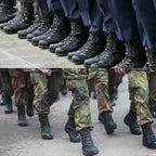 Soldiers in camouflage uniforms marching, demonstrating the functional use of black German Army combat boots.