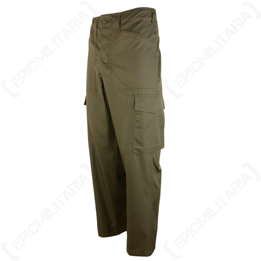 Three-quarter angle view showing the rugged cargo pockets and durable cotton-polyester blend of the Austrian M75 trousers.