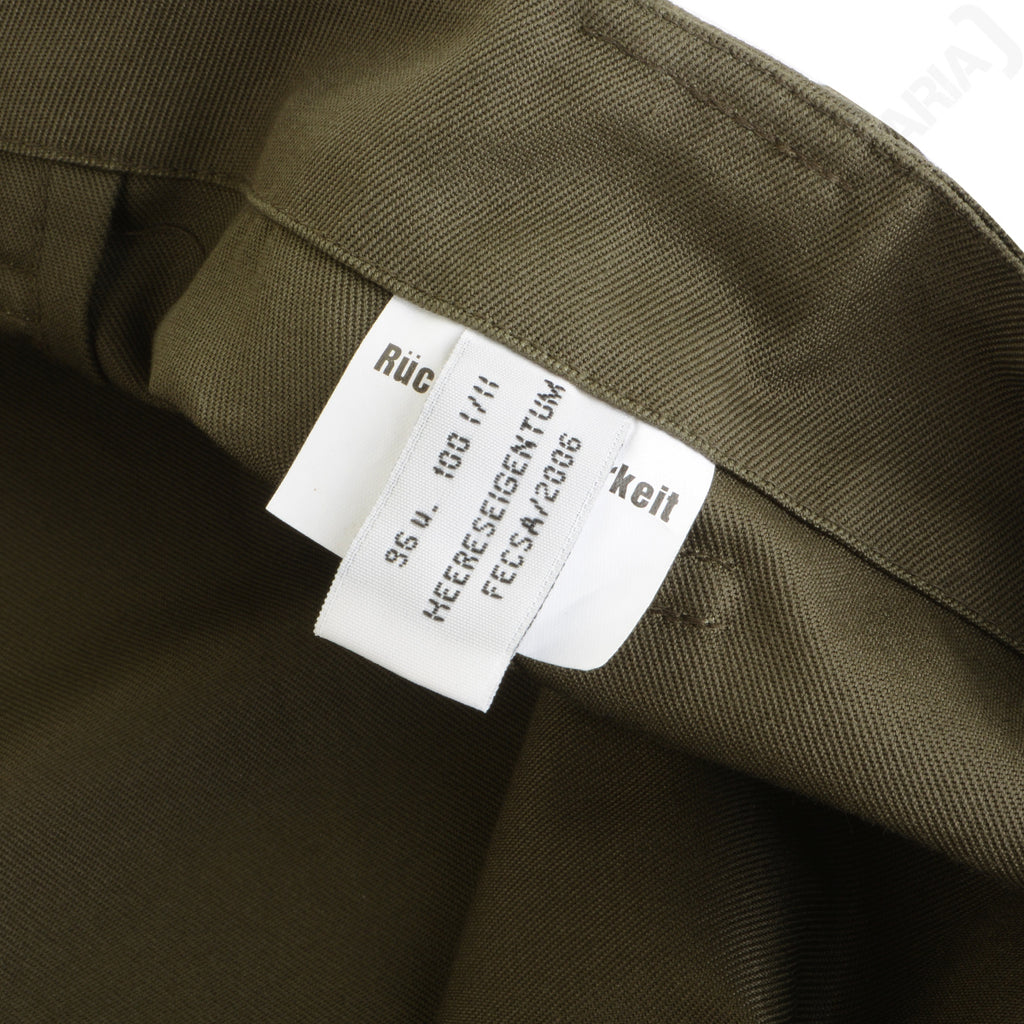 Close-up of the internal clothing label on the Austrian M75 field trousers, verifying military issue authenticity and manufacture details.