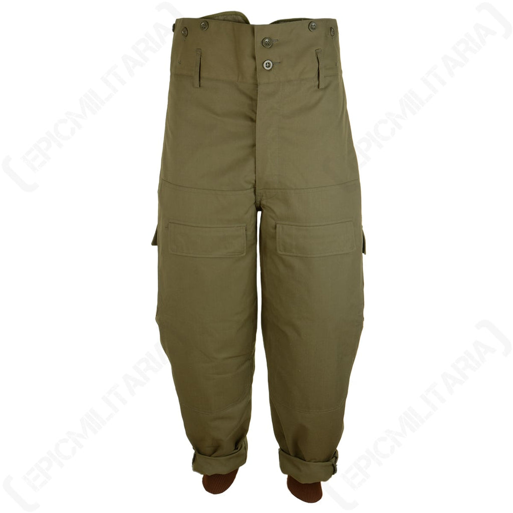 Original Czech M85 army trousers in olive drab featuring a high-waisted design, button fly, and internal ankle cuffs.