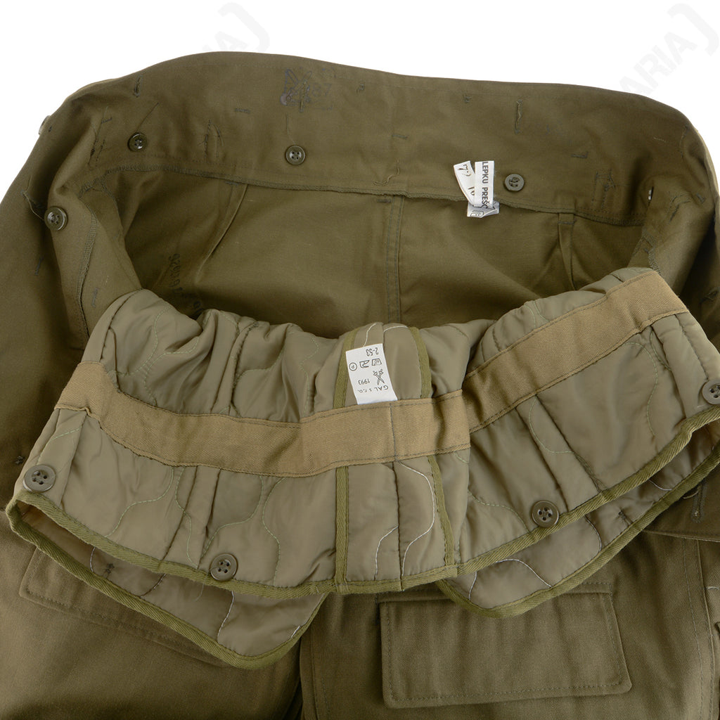Detail of Czech M85 trouser interior showing manufacturing labels, quilted liner attachment points, and reinforced construction.