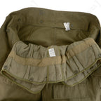 Detail of Czech M85 trouser interior showing manufacturing labels, quilted liner attachment points, and reinforced construction.