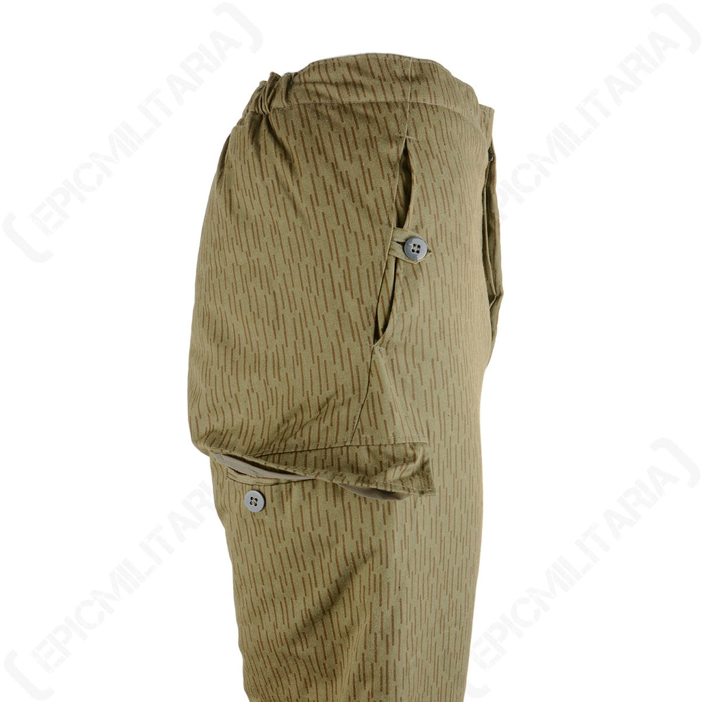Close-up side view of East German Strichtarn trousers detailing the sturdy side pockets with secure button closures for essentials.