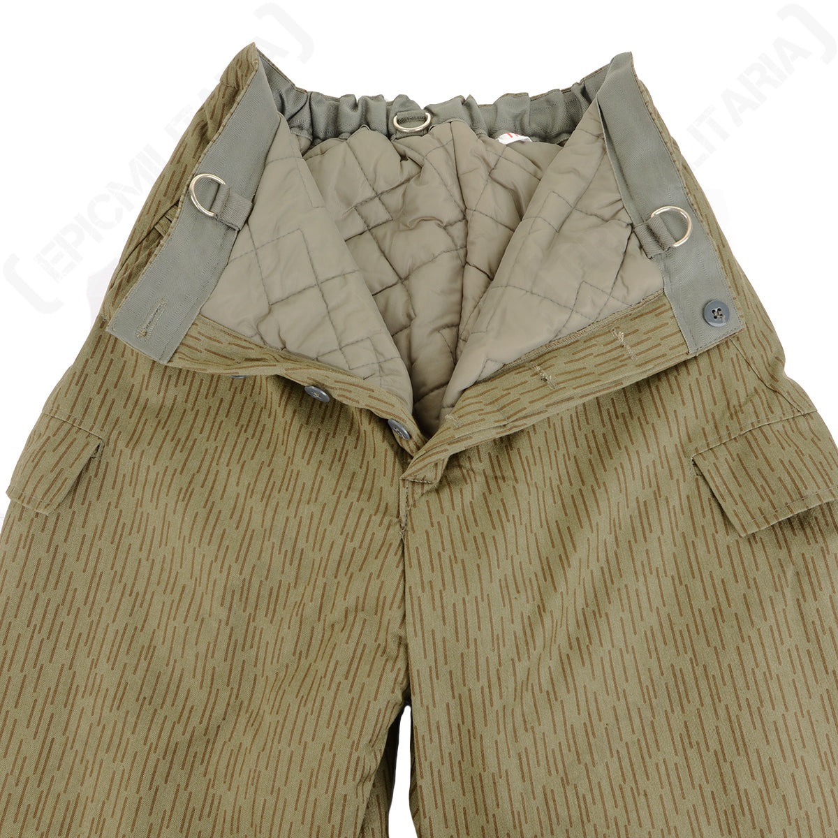Internal view of East German Strichtarn winter trousers displaying the quilted polyester padding, reinforced belt loops, and button fly closure.