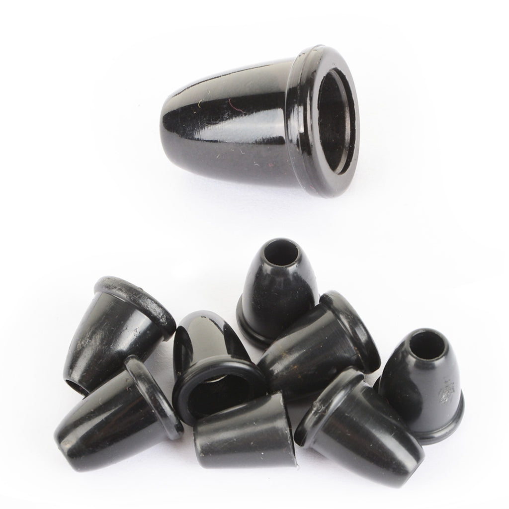 A pile of genuine British Army surplus black plastic bell-shaped cord ends for securing drawstrings and laces.