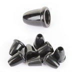 A pile of genuine British Army surplus black plastic bell-shaped cord ends for securing drawstrings and laces.
