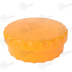 Close-up of a circular orange Austrian Army butter dish featuring a textured, scalloped bottle-cap design lid.