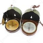 Two open Hungarian military compasses displaying dial markings and mirrored lids