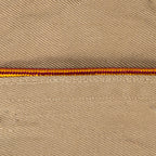 Macro shot of two-tone burgundy and yellow braided piping detail on a collector's US Army Garrison Cap.