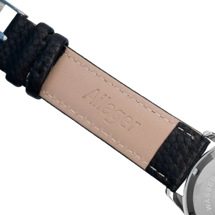 Close-up of the stamped Wasserdicht Stahlboden caseback and Ailager branded inner strap