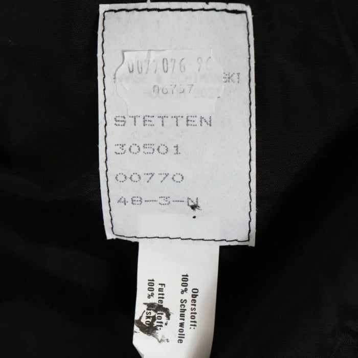 Manufacturer tag inside German military fire brigade jacket showing Haase and Schimanski Bochum markings