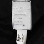 Manufacturer tag inside German military fire brigade jacket showing Haase and Schimanski Bochum markings