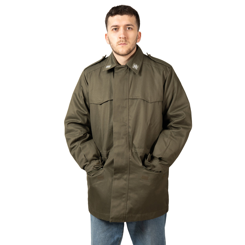 Model wearing the genuine military Roma 75 Parka with front pockets and waist drawstring.