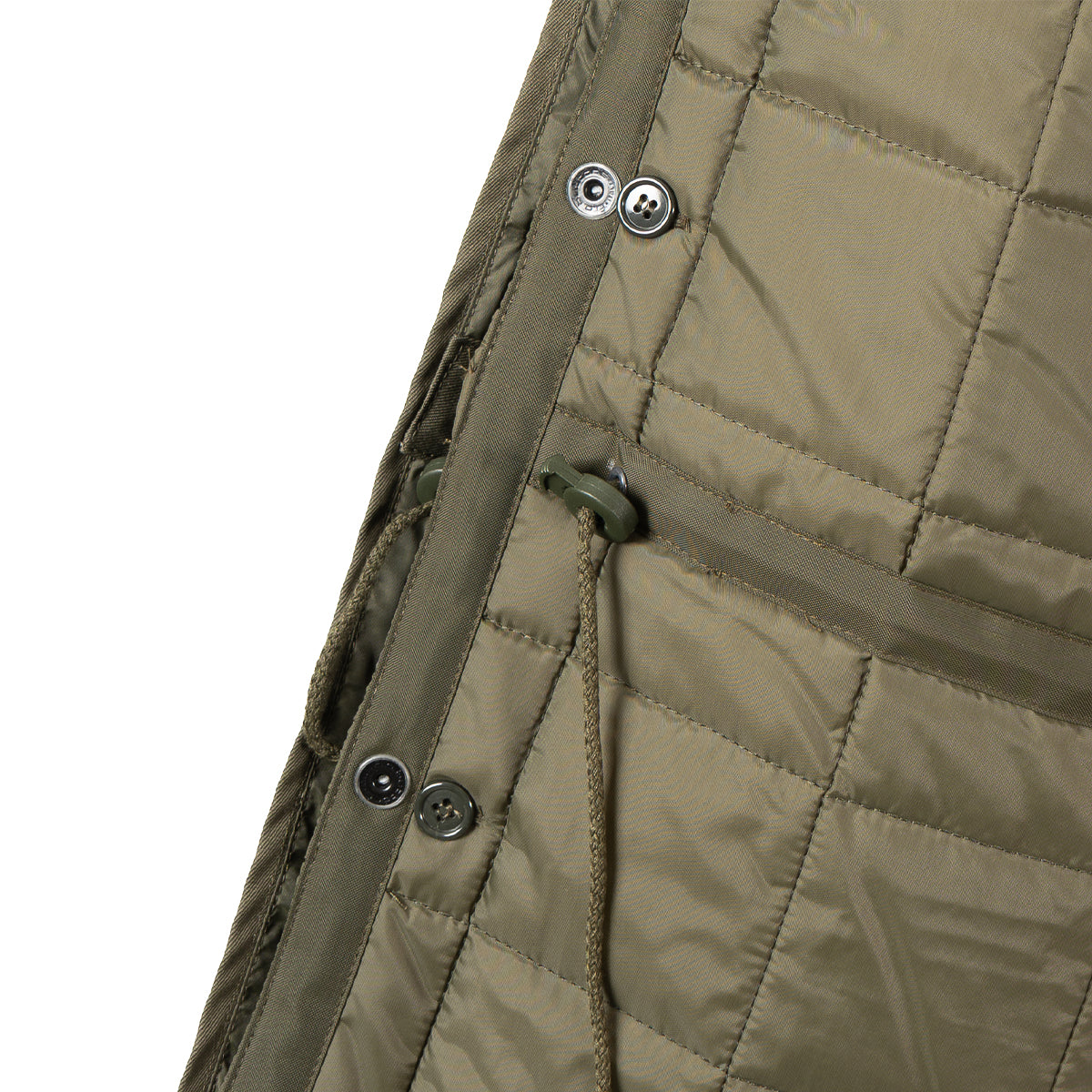 Close-up of the liner attachment toggles and drawstrings used to adjust the parka fit.