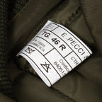 Close-up of the official military garment label with size and manufacturing details.