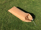 Packed French military two-man tent inside its bespoke nylon carry bag on the lawn.
