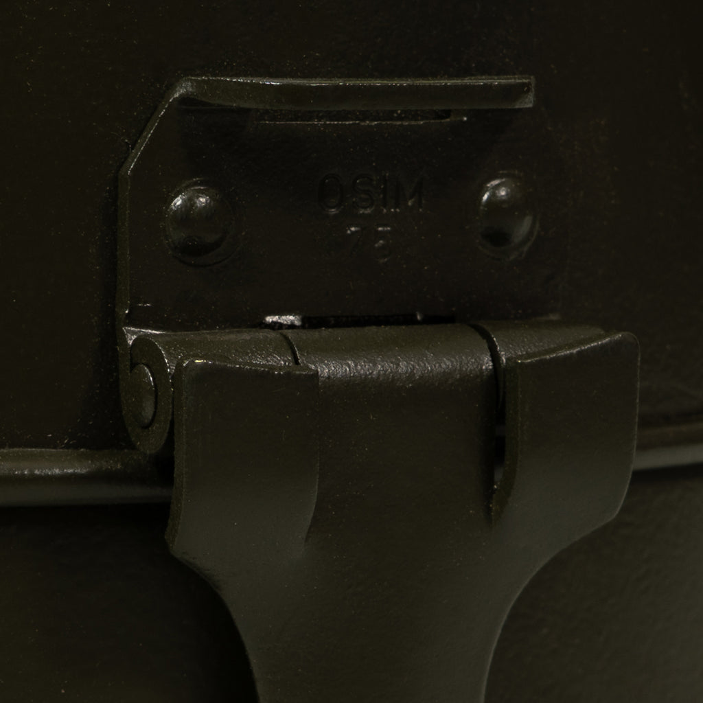 Close-up detail of the metal latch on an Italian Army mess tin clearly marked with OSIM 75, indicating Cold War era origin.