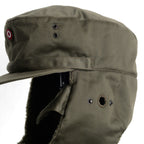 Close-up detail of the Austrian KAZ 75 winter cap, showcasing the button-covered side hearing port and robust military-grade stitching.