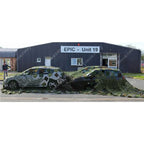 Large Czech Army camouflage net covering four cars in a car park
