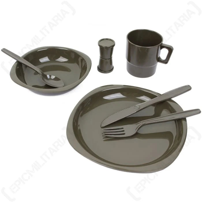 Olive drab plastic camping place setting showing plate bowl cup cutlery and shakers