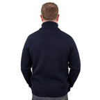 Close-up detail of elasticated ribbed sleeve cuff on navy blue wool jumper