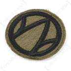 Angled view of original US Army 89th Infantry Division embroidered shoulder sleeve insignia
