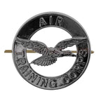 Front view of the chrome plated British Air Training Corps cap badge showing the central falcon in flight and embossed text