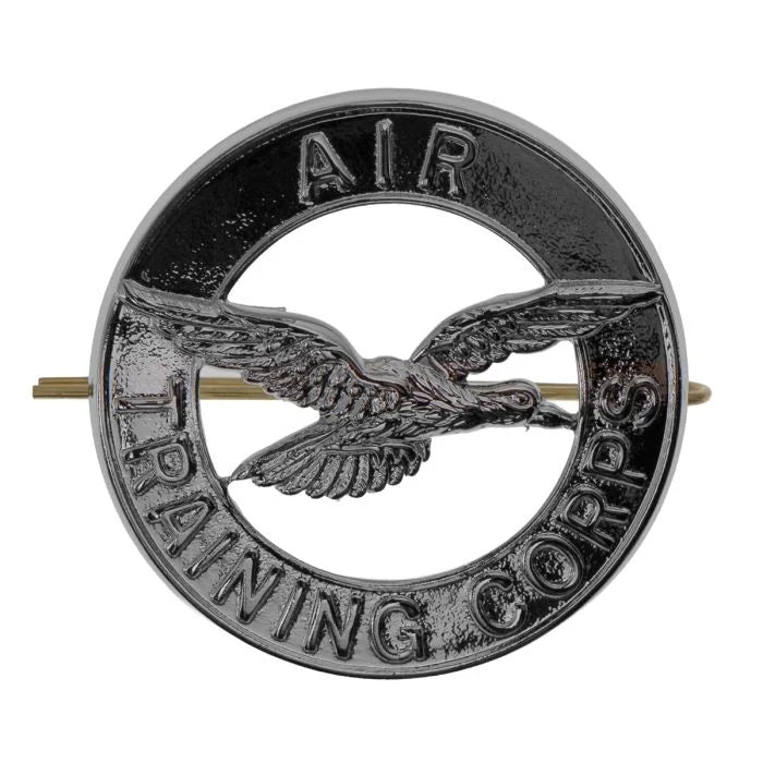 Front view of the chrome plated British Air Training Corps cap badge showing the central falcon in flight and embossed text