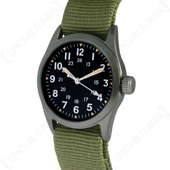 Angled view of the US Vietnam War pattern military service watch with olive green strap