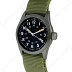 Angled view of the US Vietnam War pattern military service watch with olive green strap
