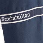 Detailed view of woven Gothic Wachbataillon cuff title embroidery on sleeve