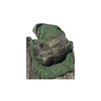 Mil-Tec Pilot sleeping bag rolled up and secured with elastic straps inside its integrated carry bag, showing the olive green interior liner.