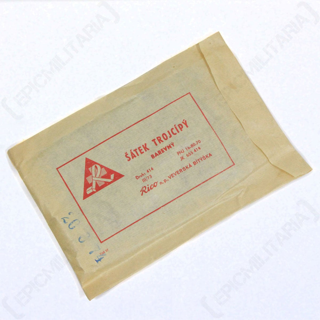 Compact original paper packet for an authentic Czech Army triangular scarf featuring red printed text and graphics.