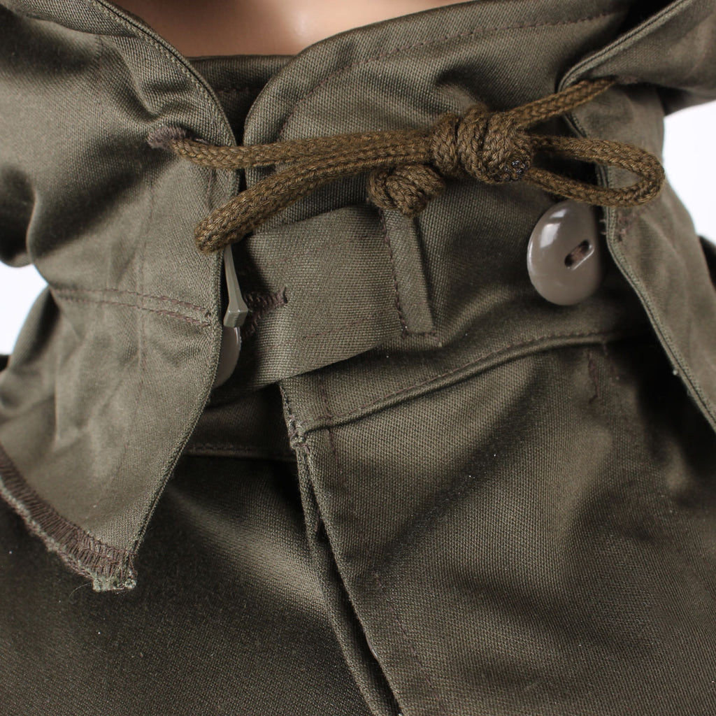 View of the collar area showing the integrated hood drawcord for a snug, heat-trapping fit.