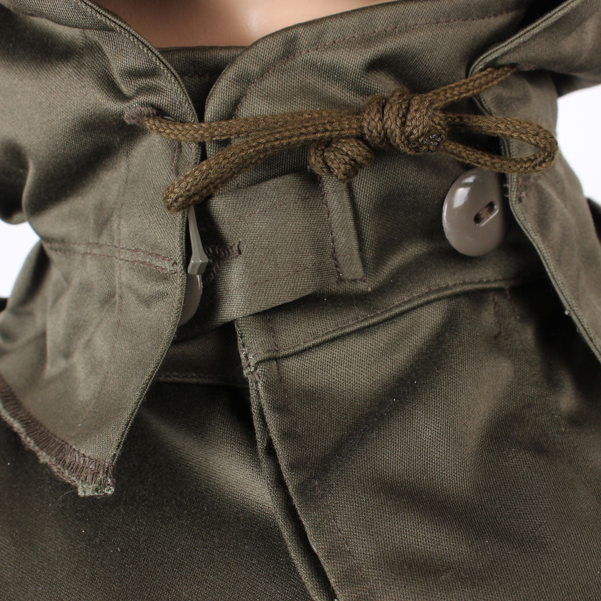 View of the collar area showing the integrated hood drawcord for a snug, heat-trapping fit.
