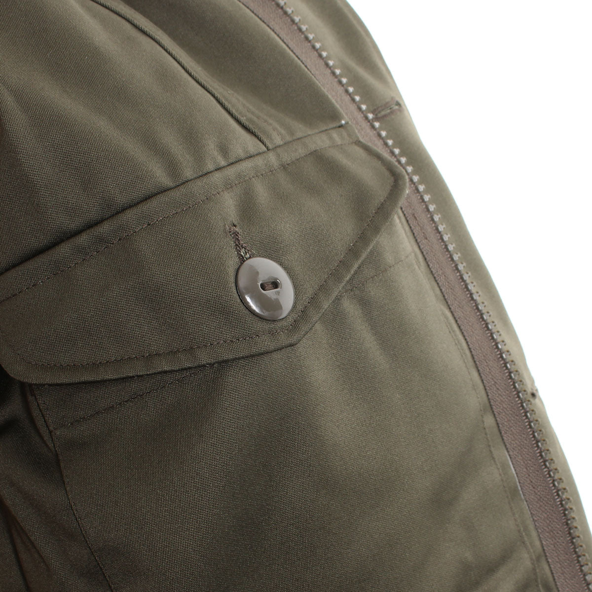 Side profile of the parka showing the heavy-duty metal zipper and protective storm flap construction.