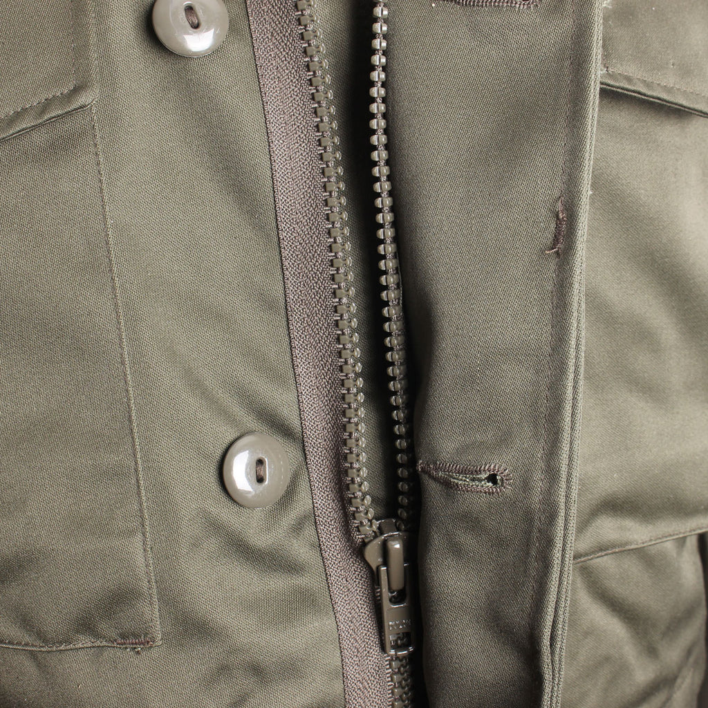 View of the heavy-duty front metal zipper protected by a wide storm flap to block cold drafts.