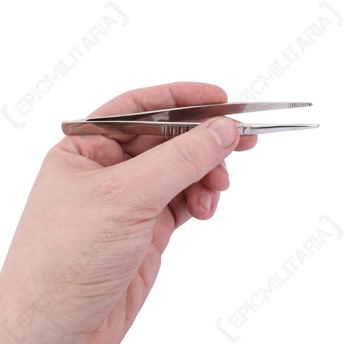 Polish Army stainless steel tweezers held in hand showing 130mm length scale
