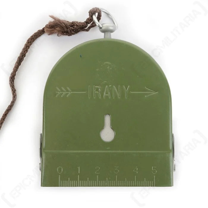 Olive green metal lid of Hungarian army compass showing IRÁNY marking and 5 cm scale