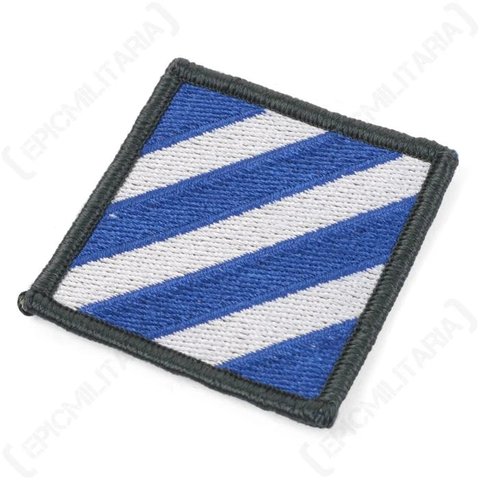 Angled close up showing stitched detail and merrowed border on US 3rd Infantry Division patch
