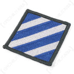 Angled close up showing stitched detail and merrowed border on US 3rd Infantry Division patch
