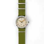 Full front vertical lay of the British ATP Service Watch with green strap